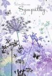 The artwork on this sympathy card unfolds in soft layers, much like a misty morning settling over the quieter corners of St Mary Cray. Slender, arching stems rise from the lower edge, washed in cool grey-green and smoky blue tones, each one carrying a fine, umbrella-like cluster of wildflower blooms. These umbellifer heads are painted with intricate, lacework strokes, tiny dots and lines forming airy circles in tones of lavender, faded violet, and muted indigo. The flowers appear almost translucent at their edges, as if their colour is gently dissolving into the air. Behind them, a velvety wash of purples and pale greens flows across the card, softly blurred and without sharp definition, creating a sense of open space that could be a far-off sky or distant fields beyond the local streets and gardens. Light, nearly invisible butterflies drift among the blossoms, their wings tinted with just a hint of the surrounding hues, evoking transformation, memory, and the subtle presence of those we've lost. The lighting is low and diffuse, casting no hard shadows, only a quiet, even glow that calms rather than startles. In my work creating funeral tributes for families throughout St Mary Cray, I often see how people are drawn to designs that speak gently, without excess. This card captures that feeling perfectly: a visual murmur of sympathy, respectful and understated, yet filled with emotion. It offers a scene that invites the viewer to pause, breathe, and hold their loved one in thought, much as you might stop beside a peaceful riverbank and simply remember.